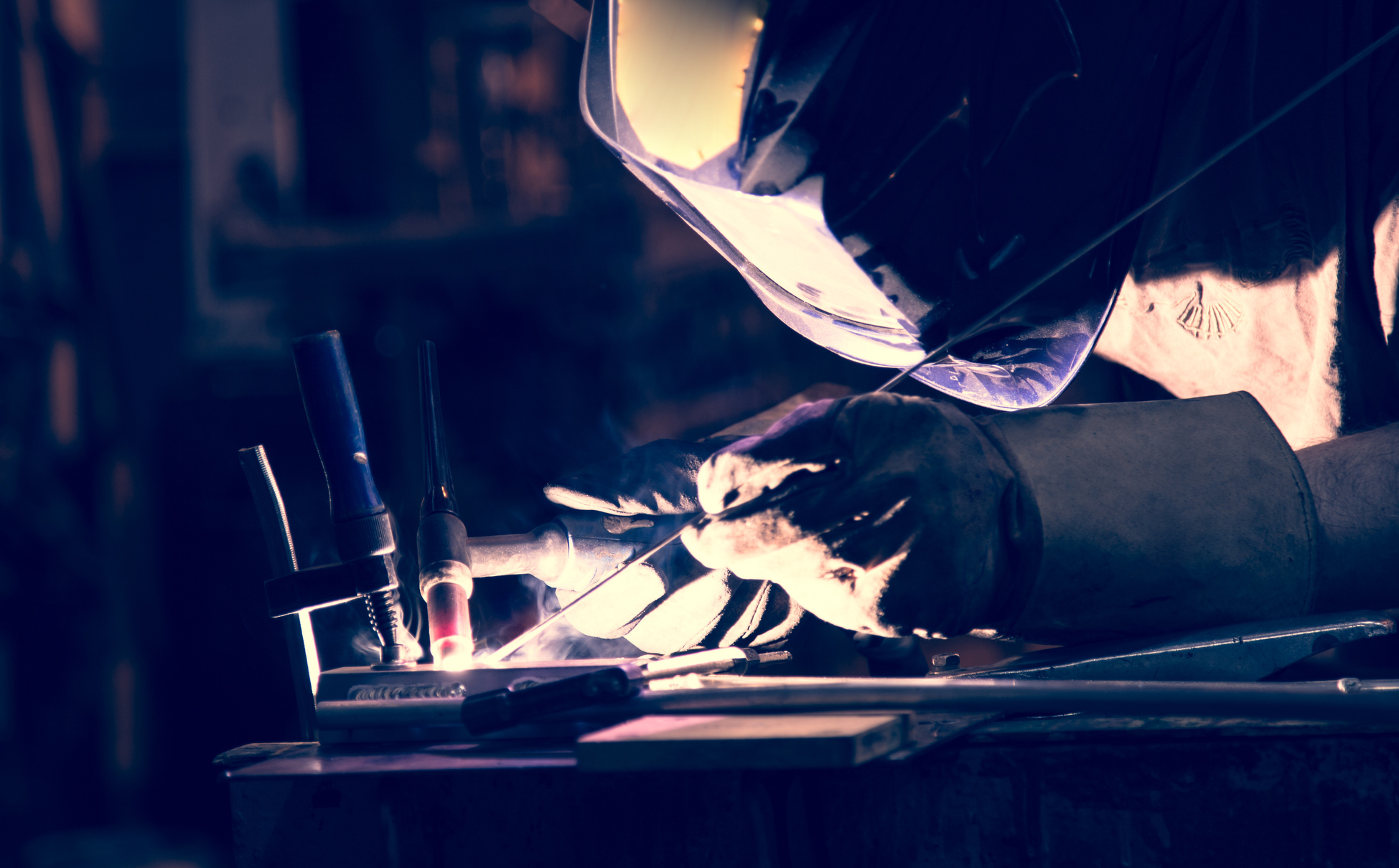 Employee welding aluminum using TIG welder.